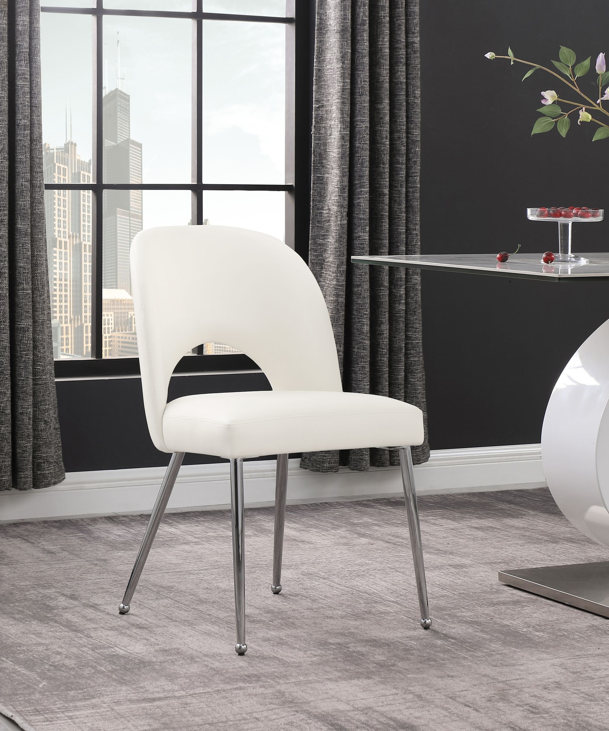 Logan Faux Leather Dining Chair with Chrome Ball Leg Design
