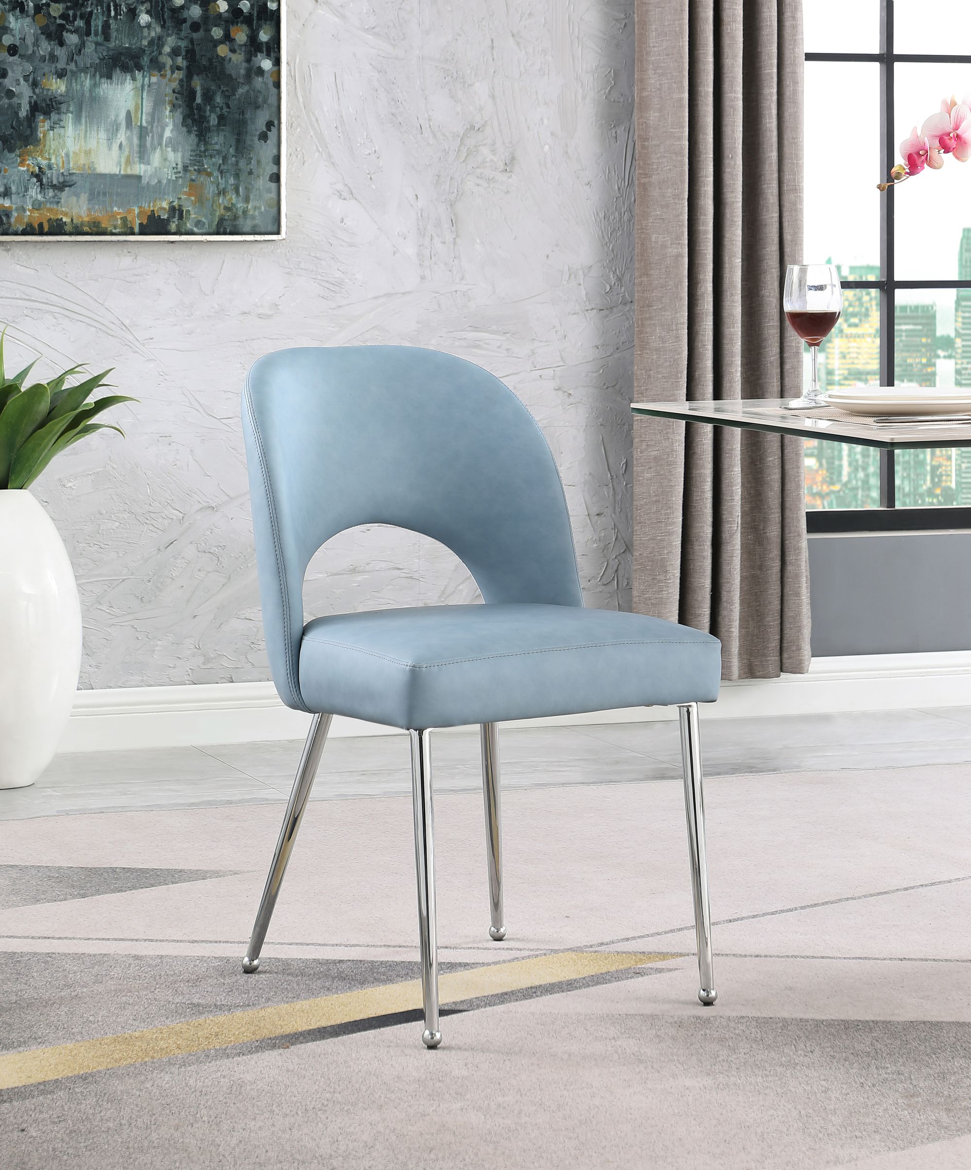 Logan Faux Leather Dining Chair with Chrome Ball Leg Design