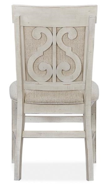 Relaxed Upholstered Dining Side Chair with Decorative Carvings
