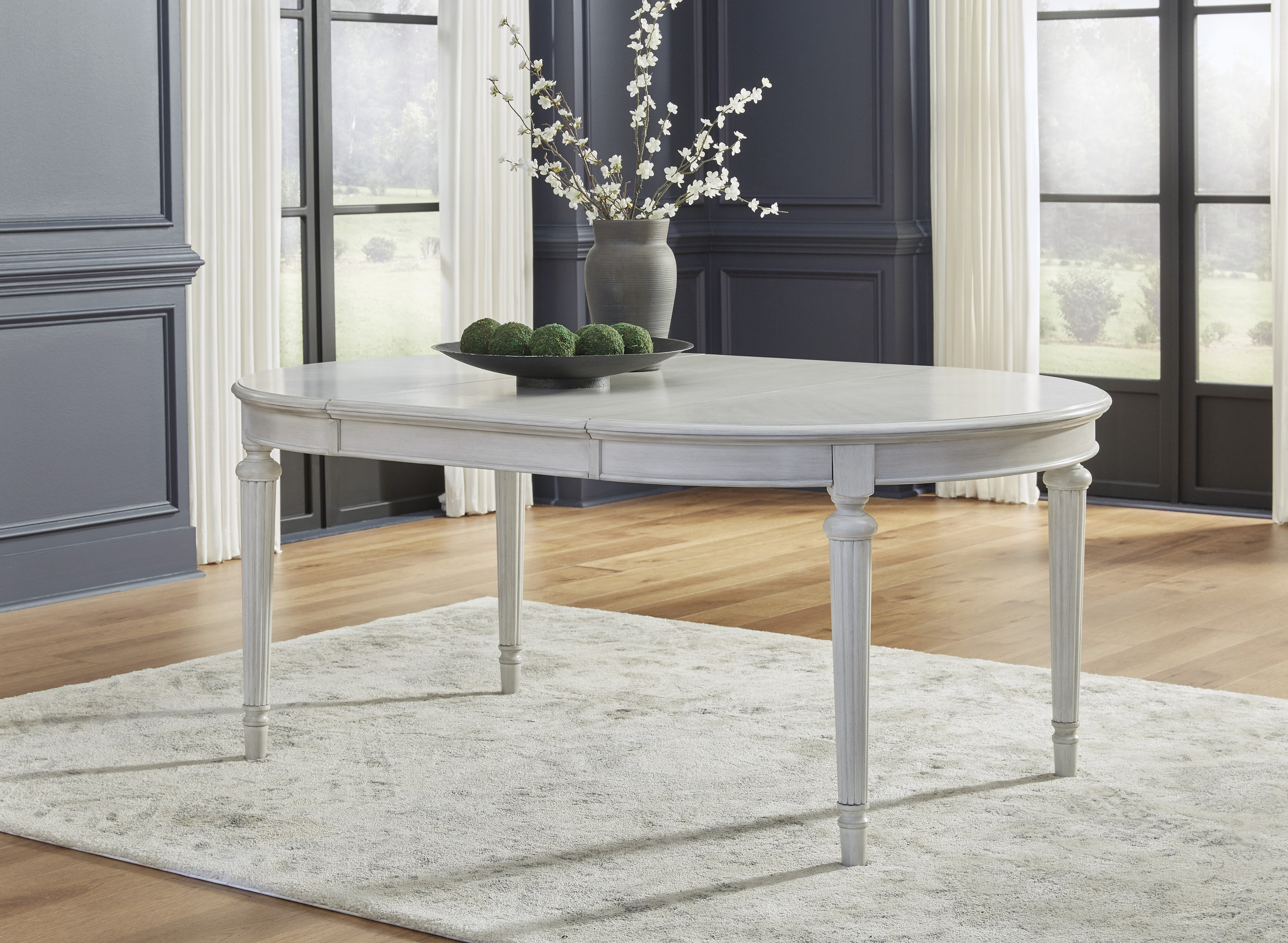 Montelaine Round Extendable Dining Table in Antique White