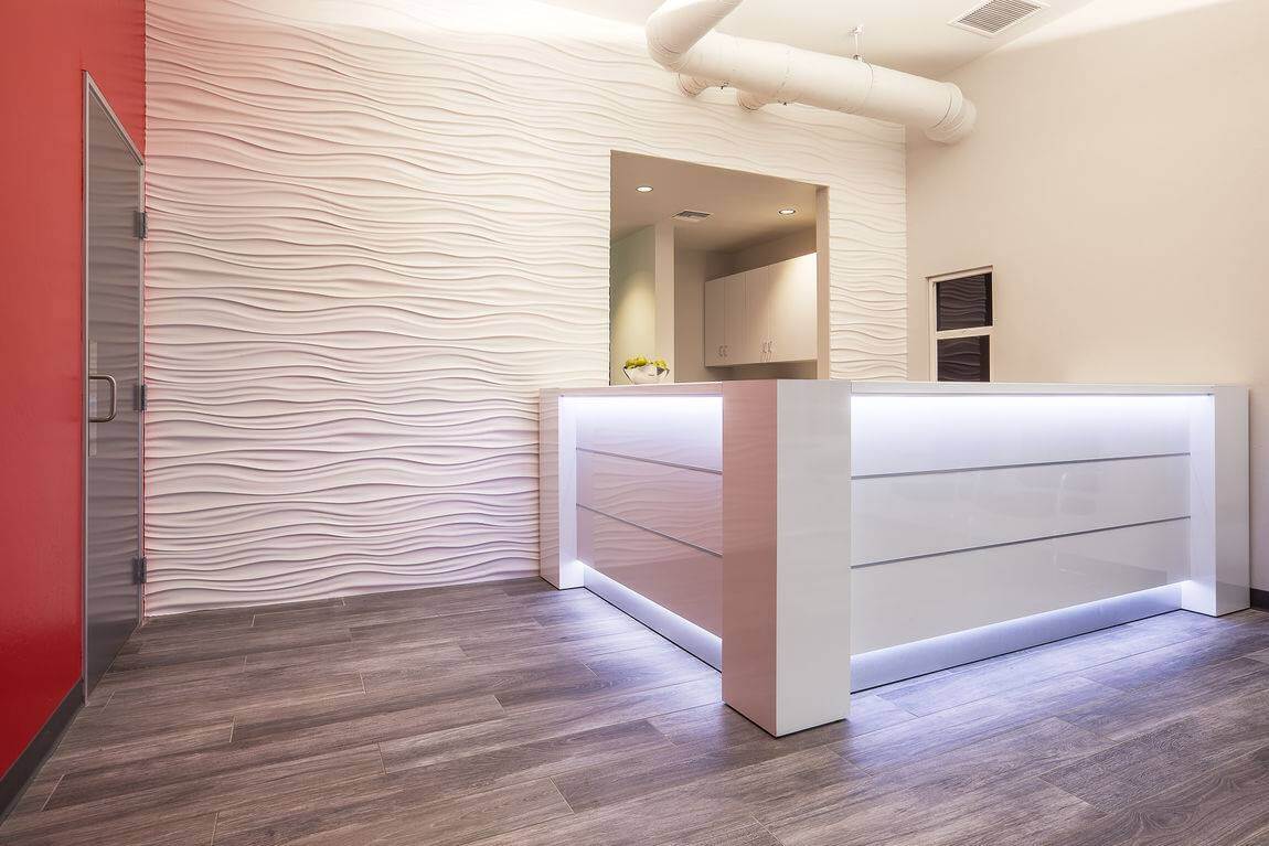 Valde 114"x75" Corner Reception Desk in white with LED light